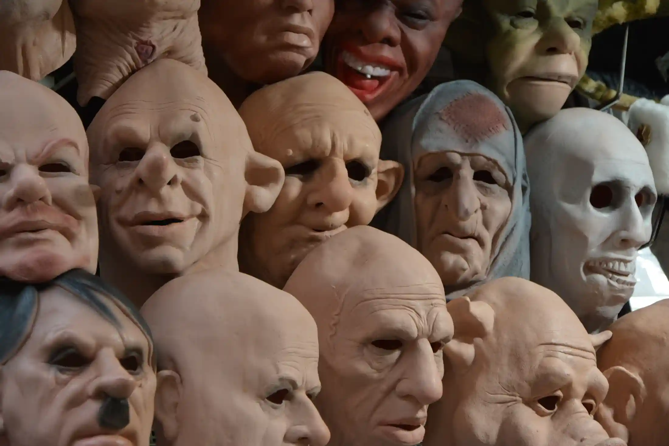A wall of masks hinting at the selection inside Crypt Keepers